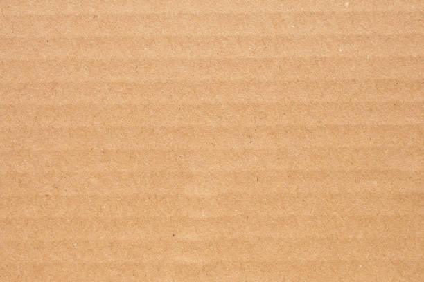 istock Brown eco recycled cardboard paper sheet texture background 1324665070