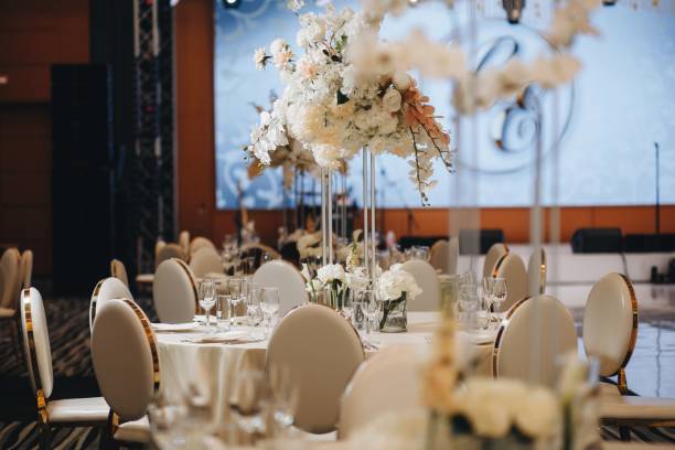 istock tableware Glasses, flower fork, knife served for dinner in restaurant with cozy interior 1324666185