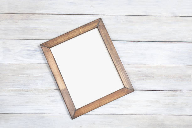 istock A vintage wooden frame lies on a plank table 1324667044