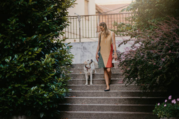 istock Young Woman Walks Her Dog 1324670110
