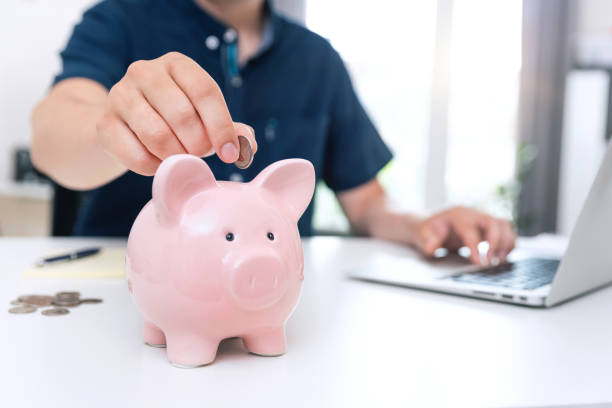 istock Saving money with piggy bank concept 1324673175