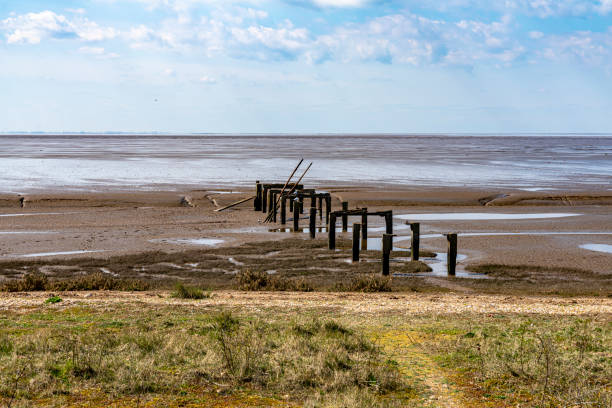 istock Old pier and mudflats at Snettisham, Norfolk. 1324673270