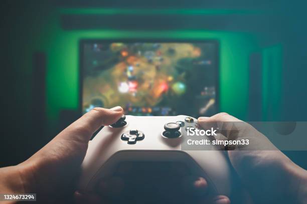 Video Gaming Console Man Playing Rpg Strategy Game Stock Photo - Download Image Now
