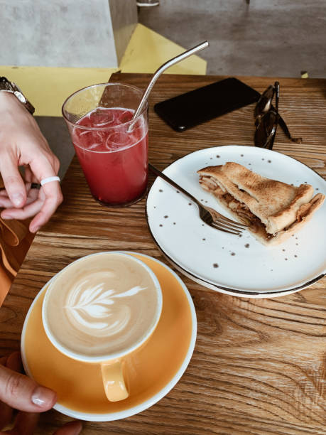 istock A cup of cappuccino and apple pie on the wooden table 1324673792