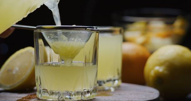 preparing homemade orange lemonade - colander imagens e fotografias de stock