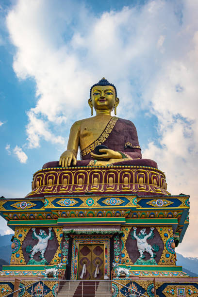 istock huge buddha golden statue from different perspective with bright blue sky at evening 1324677559