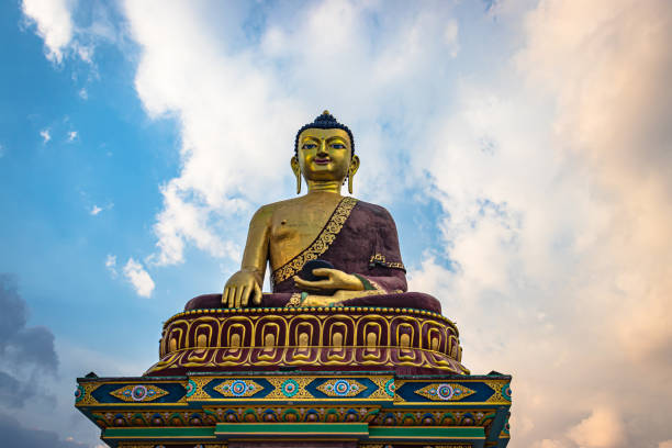 istock huge buddha golden statue from different perspective with bright blue sky at evening 1324677667