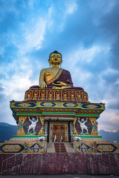 huge buddha golden statue from different perspective with moody sky at evening