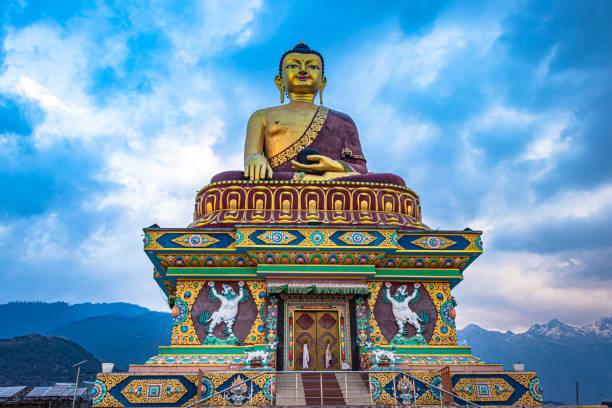 istock huge buddha golden statue from different perspective with moody sky at evening 1324678274
