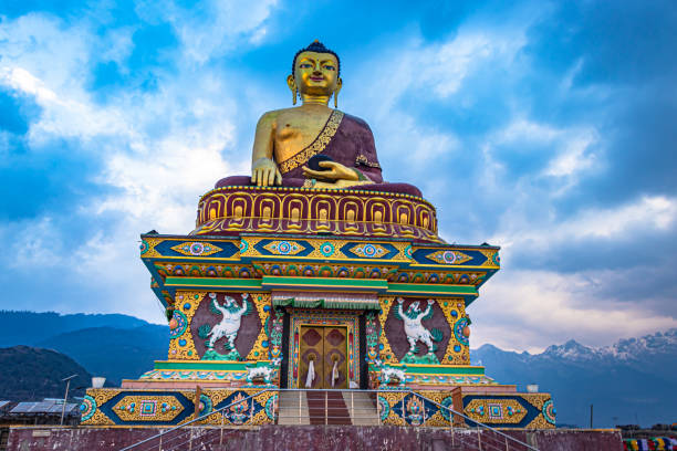 istock huge buddha golden statue from different perspective with moody sky at evening 1324678303