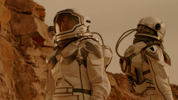 istock Male and female cosmonauts looking around 1324679213
