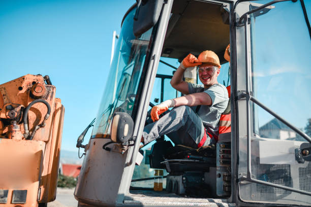 istock Bulldozer Driver Stressed And Exhausted By Heat In Cockpit 1324681099