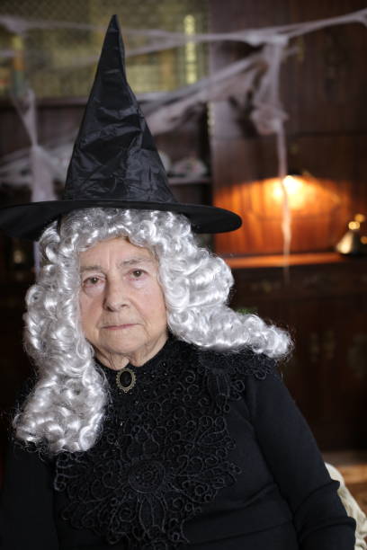 istock Senior witch with white curly hair 1324683558