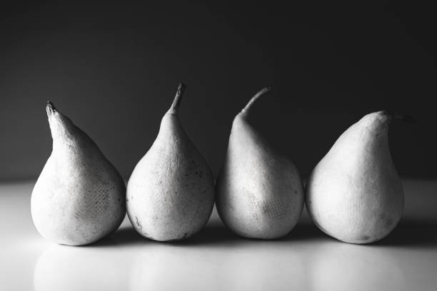 Various pears on a black background, close-up