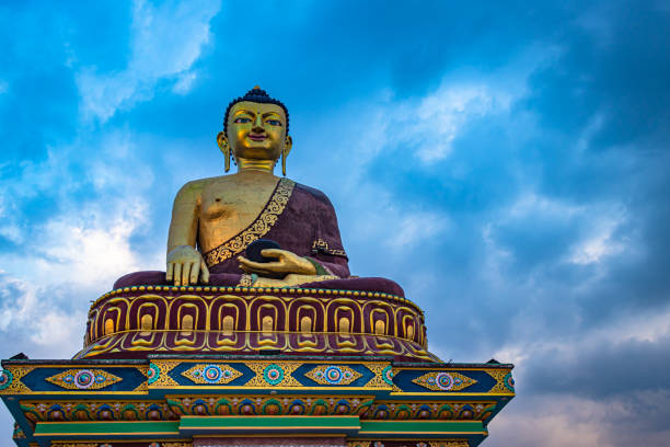istock huge buddha golden statue from different perspective with moody sky at evening 1324684392