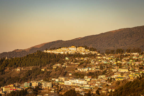 istock tawang city view with orange sky from hill top at evening 1324684871