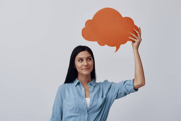 istock Thoughtful young woman smiling 1324684999