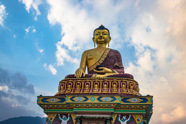 istock huge buddha golden statue from different perspective with bright blue sky at evening 1324685055