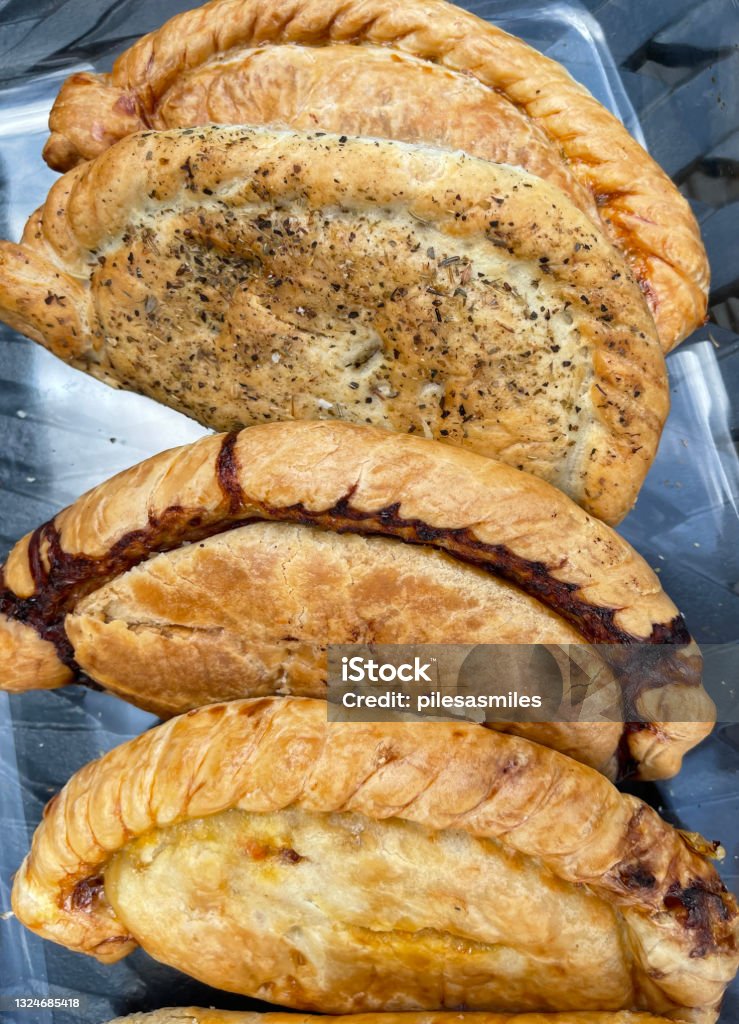 'Cornish Pasties', Totnes, Devon, England, UK An array of 'Cornish Pasties' - pictures from the market town of Totnes, at the head of the River dart in Devon, England, UK Cornish Pasty Stock Photo