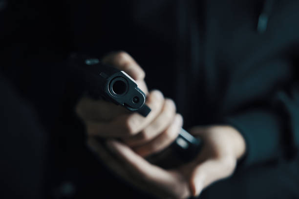 istock Close up of man reloading pistol. 1324686115