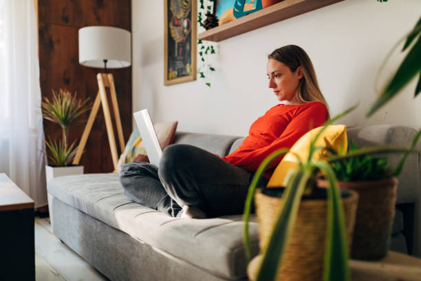 istock Dedicated woman using her free time during weekend to organise her working plan for the next week 1324688173