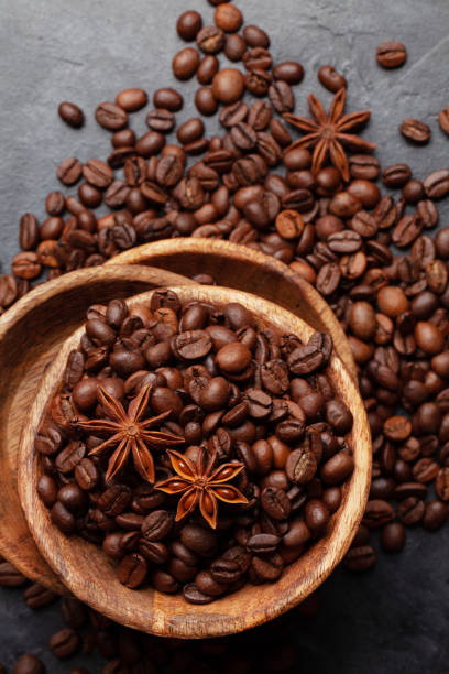 istock Roasted coffee beans in wooden bowl 1324688513