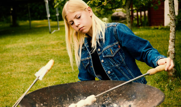 istock 14 years old girl baking bread 1324691543
