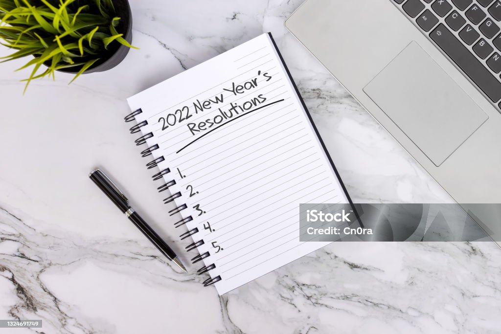 2022 New Year's Resolution Text on Note Pad New Year 2022 concept New Year Resolution Stock Photo