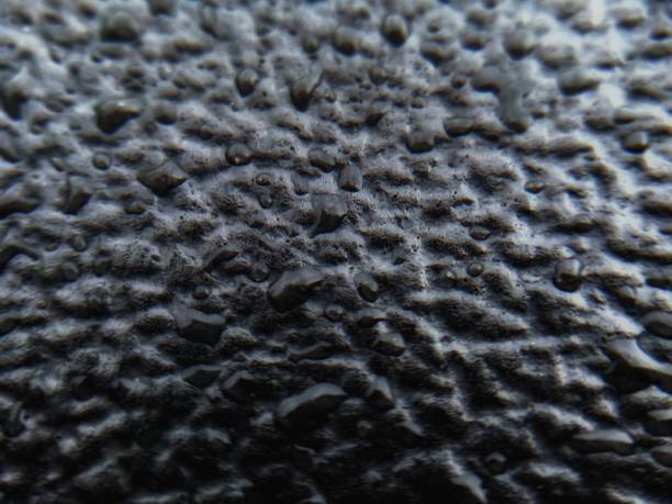 istock raindrops on the rubber of the motorcycle seat 1324693889