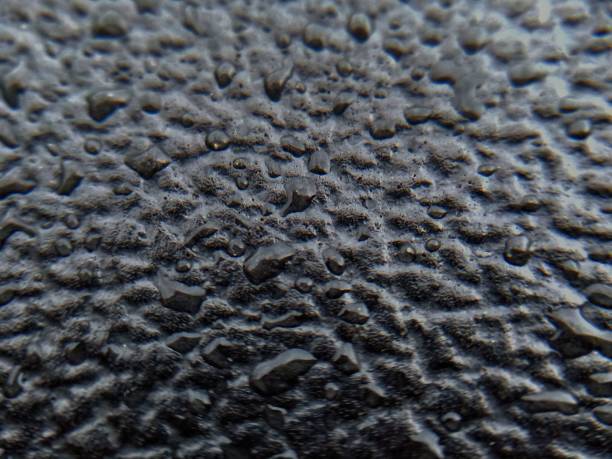 istock raindrops on the rubber of the motorcycle seat 1324693915