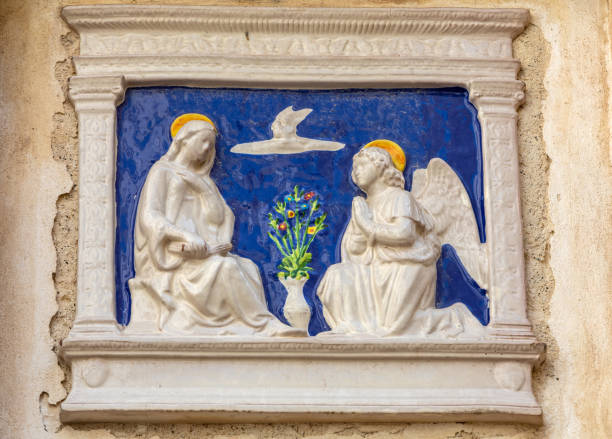 Polignano a Mare, Italy - September 17, 2019: Marble bas-relief depicting the Annunciation on the wall of a house in Polignano a Mare. Italy