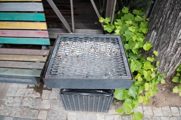 istock A dedicated smoking area. Trash can for smoked cigarettes. Rest bench 1324694890