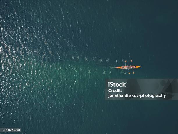 Row Boat In Ocean Stock Photo - Download Image Now - Rowing, Sport Rowing, Teamwork