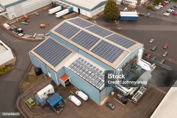 High Angle View Of Agricultural Building With Solar Panels Stock Photo - Download Image Now