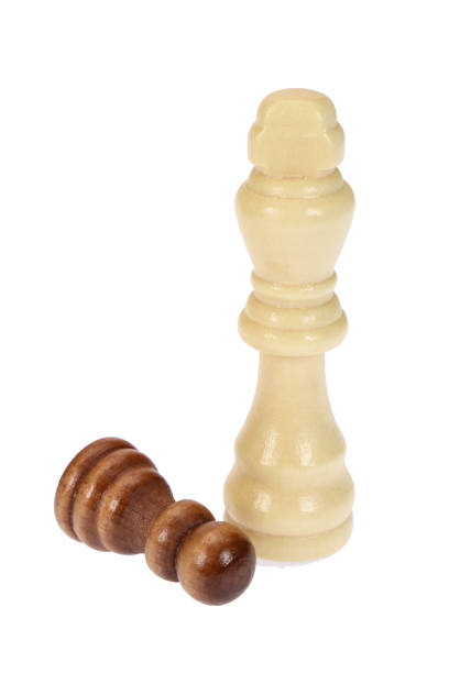 istock A white chess king and a defeated black pawn on a white background, isolated image 1324697100