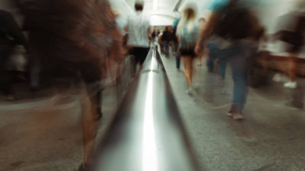 istock Abstract background of blurred movement of people in the underpass. 1324697708