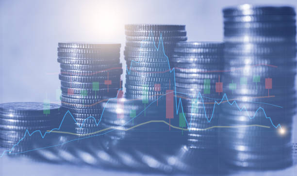 istock double exposure row of coin stack with growth stock chart and graph progress report for business investment finance banking and money saving concept. 1324698203