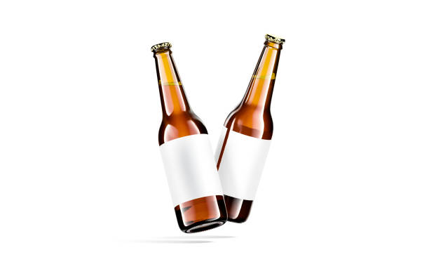 istock Blank brown glass beer bottle white label mockup, no gravity 1324698840
