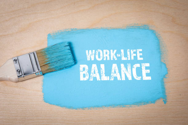 istock Work life balance. Blue paint and brush on a wooden surface 1324699155