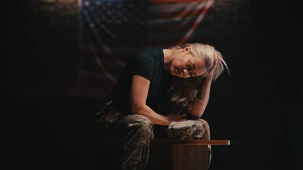 Exhausted female soldier resting on bench