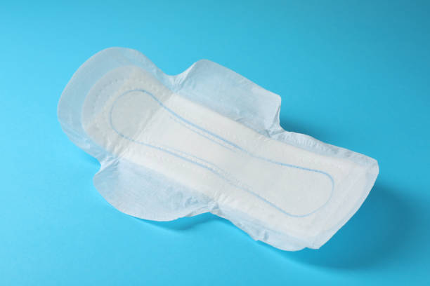 istock Sanitary napkin on light blue background. Gynecology concept 1324700316