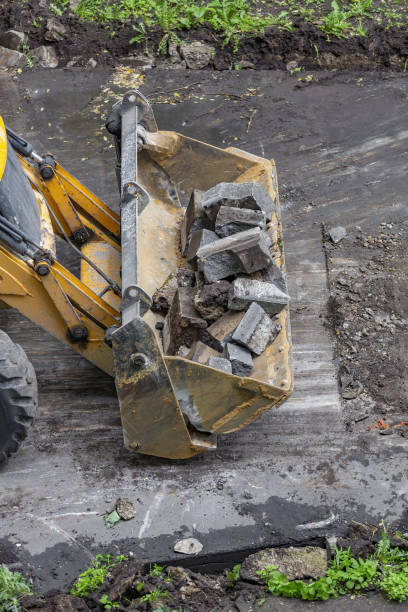 istock Specialized bulldozer for road repair and paving. In action 1324700504