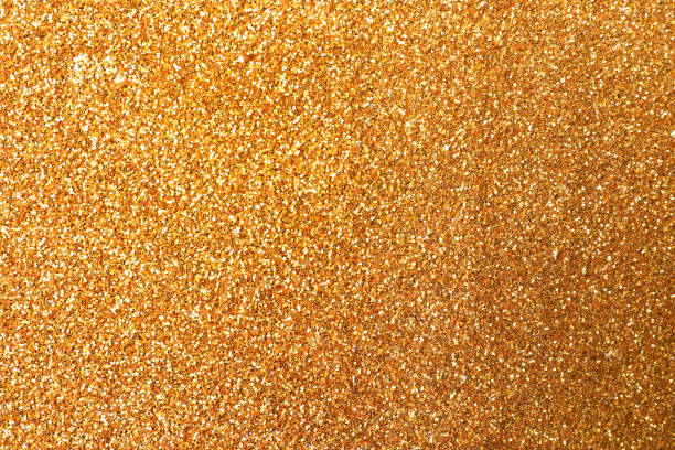 istock Beautiful shiny golden glitter as background, closeup 1324700818
