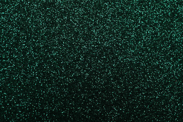 istock Shiny dark green glitter as background, closeup 1324700904