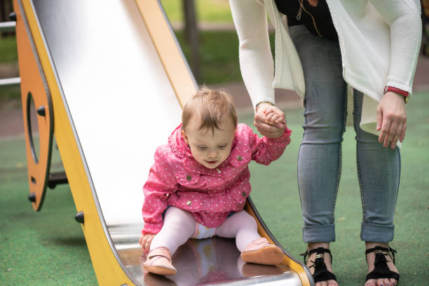 istock Baby girl having fun on a playground 1324701985