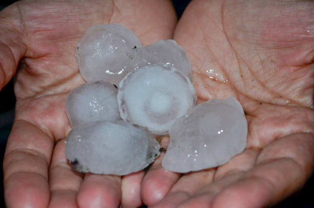 istock Big hailstone on the hand 1324702848