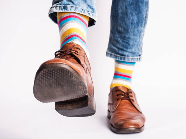 istock Men's legs, trendy shoes and bright socks 1324704204