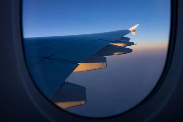Close-up shot of the aircraft wing of an Airbus A380 super jumbo from the window.