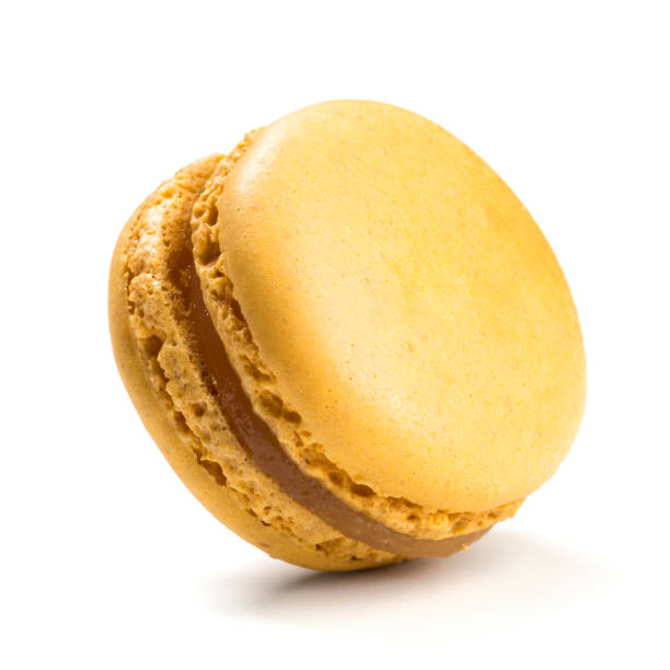 istock Lemon flavor macaron isolated on white 1324705449
