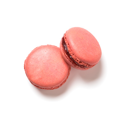 Raspberry flavor macarons top view isolated on white background
